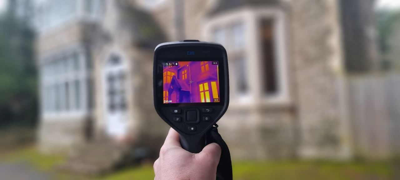 house with thermal imagining gun